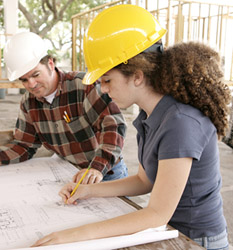 Engineers marking up prints for Engineering Project